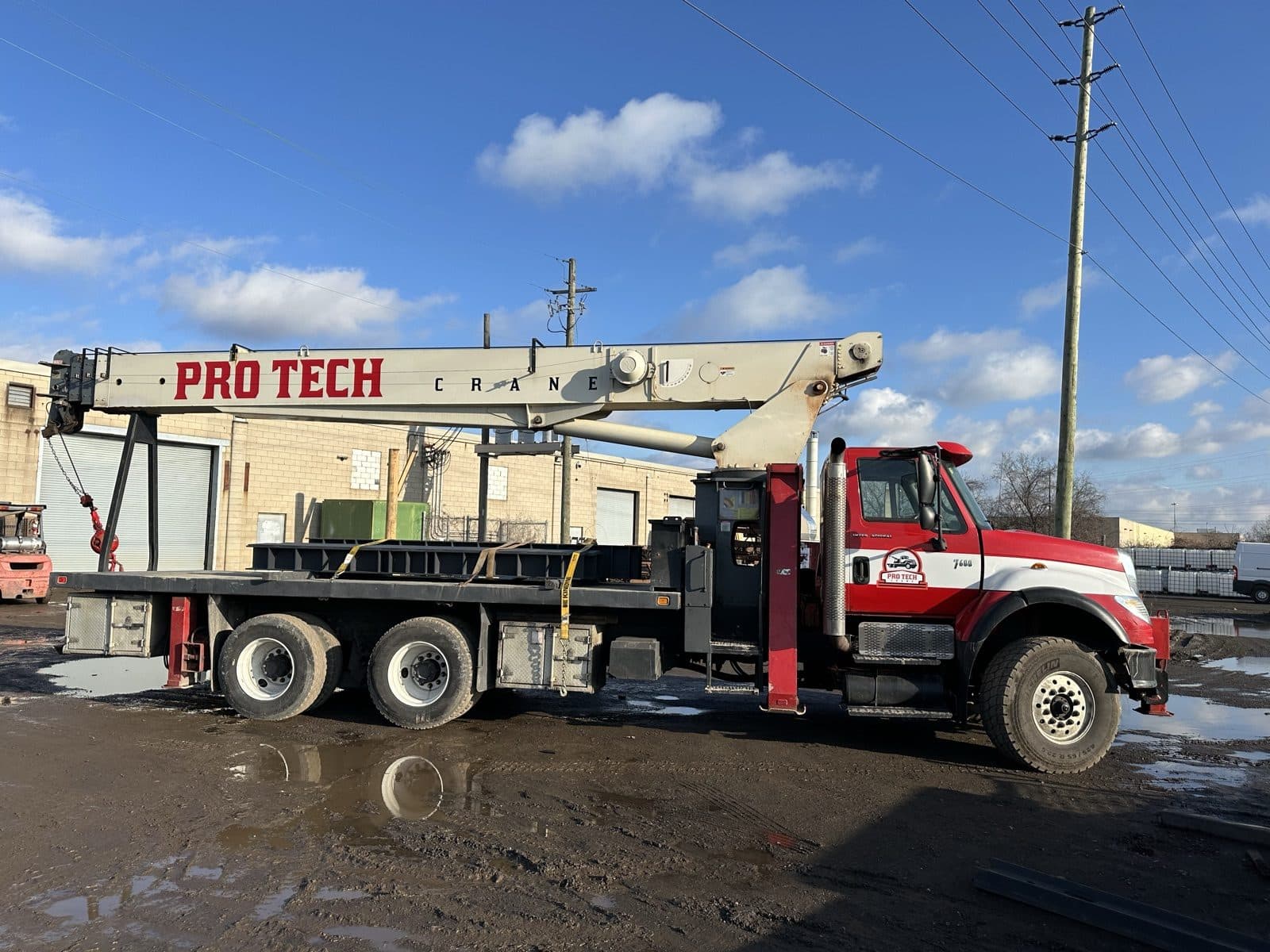 Boom truck loaded with fabricated steel, ready for delivery