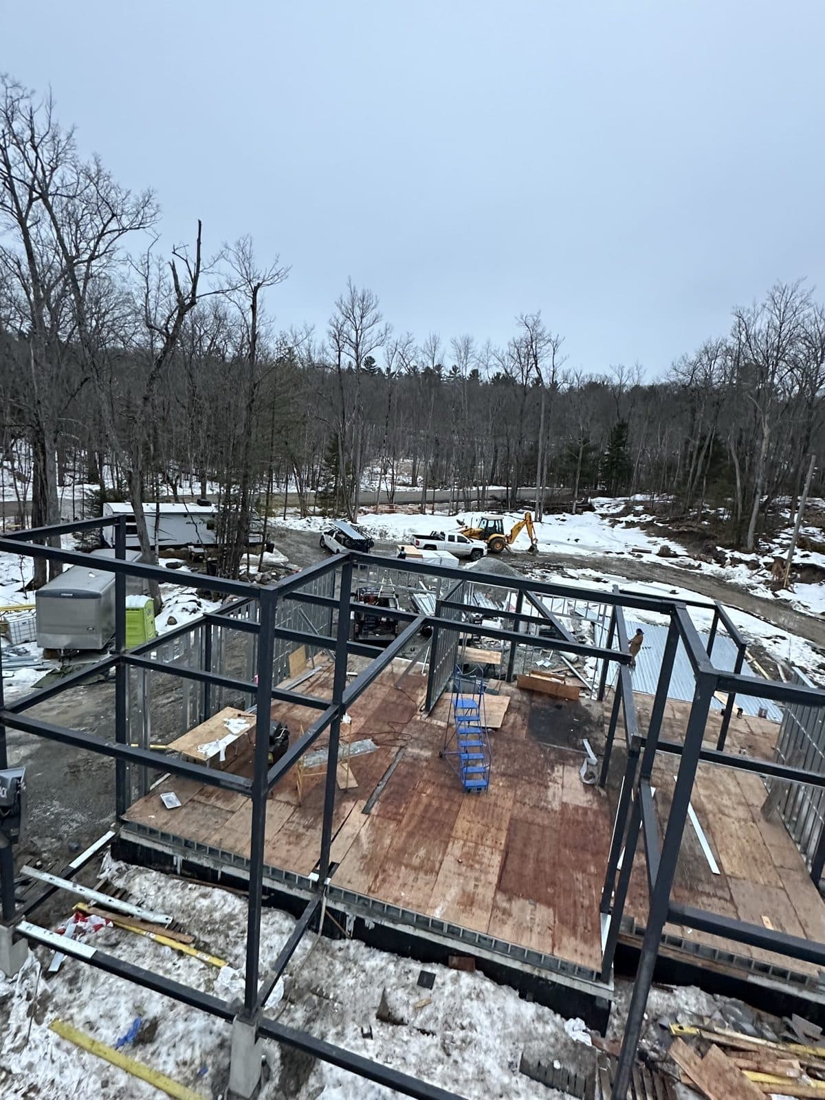 Structural steel frame and floor deck on an active winter build site